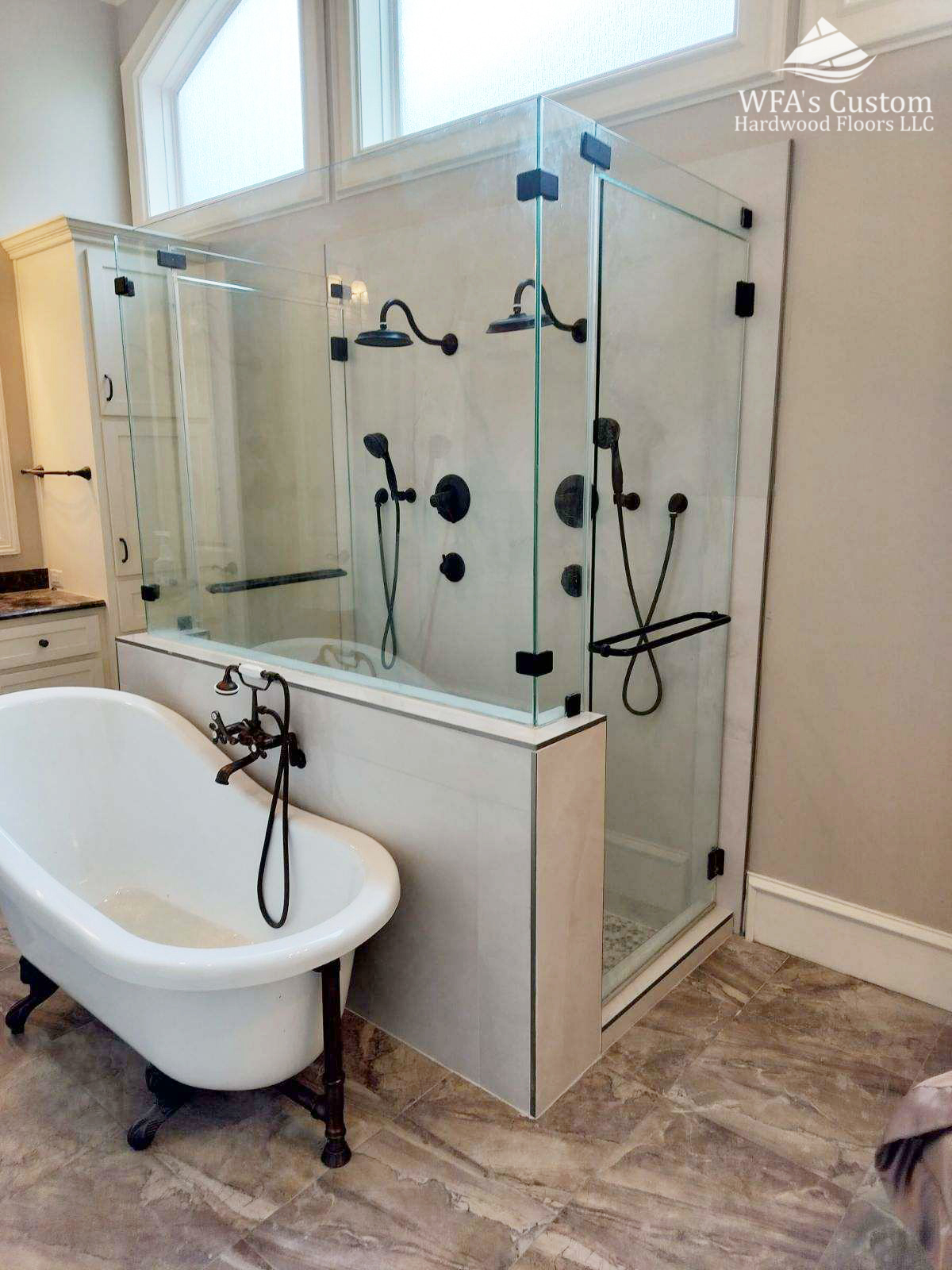 tile shower installation with a half wall and custom shower glass, wfa's custom hardwood floors, houston texas